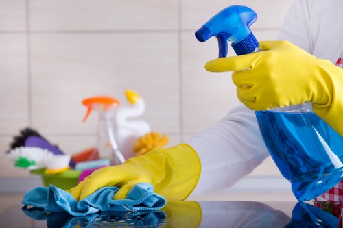 Professional oven cleaner in Mayfair removing grease from a kitchen oven
