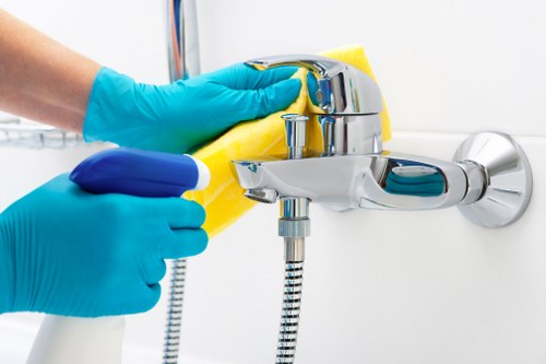 Window cleaner servicing Mayfair office glass with care