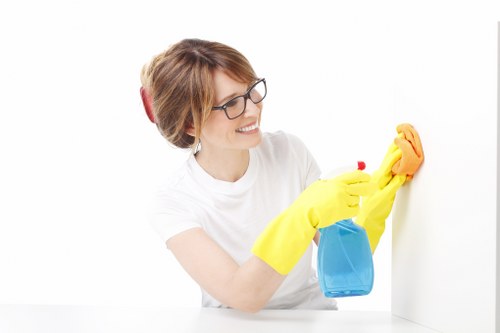 Cleaning staff using equipment safely with attention to hazard control